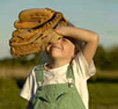Child with baseball glove.