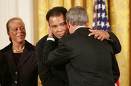 President George W. Bush honors Muhammad Ali with the 2005 Presidential Medal of Freedom.